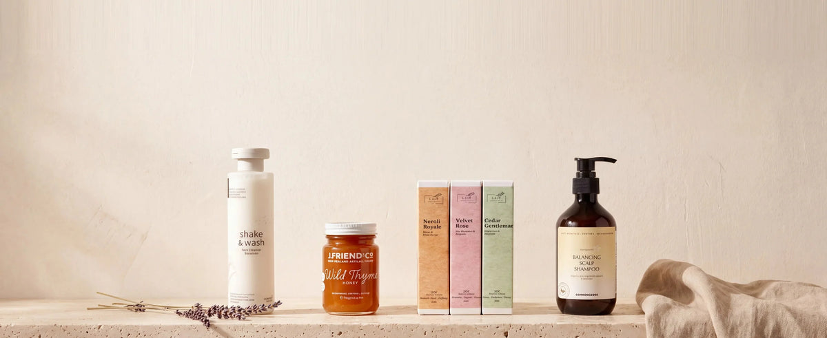 Best selling face cleanser, honey, perfumes and shampoo on a plaster shelf